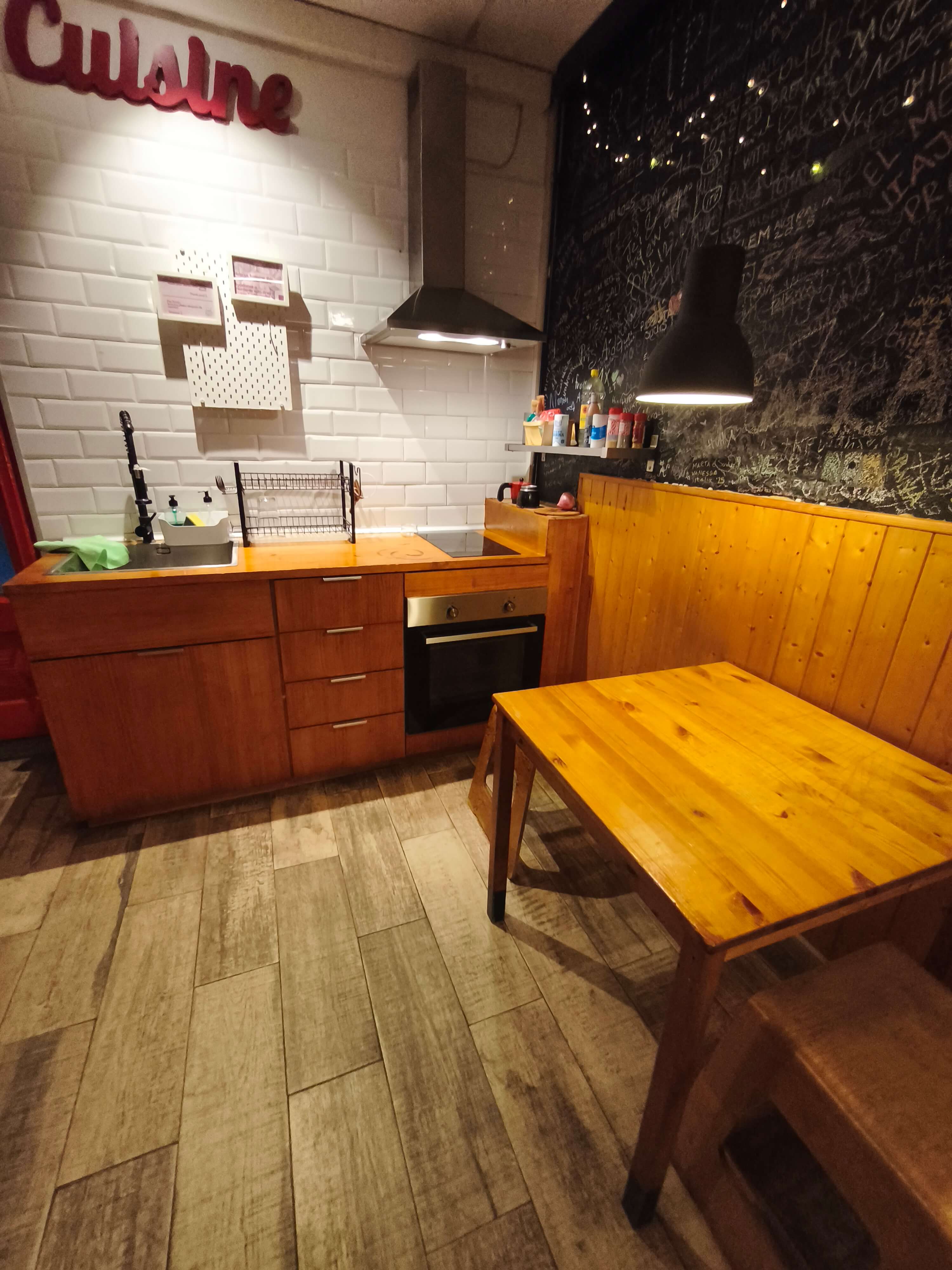 Modern kitchen facilities for guest use in Barcelona hostel