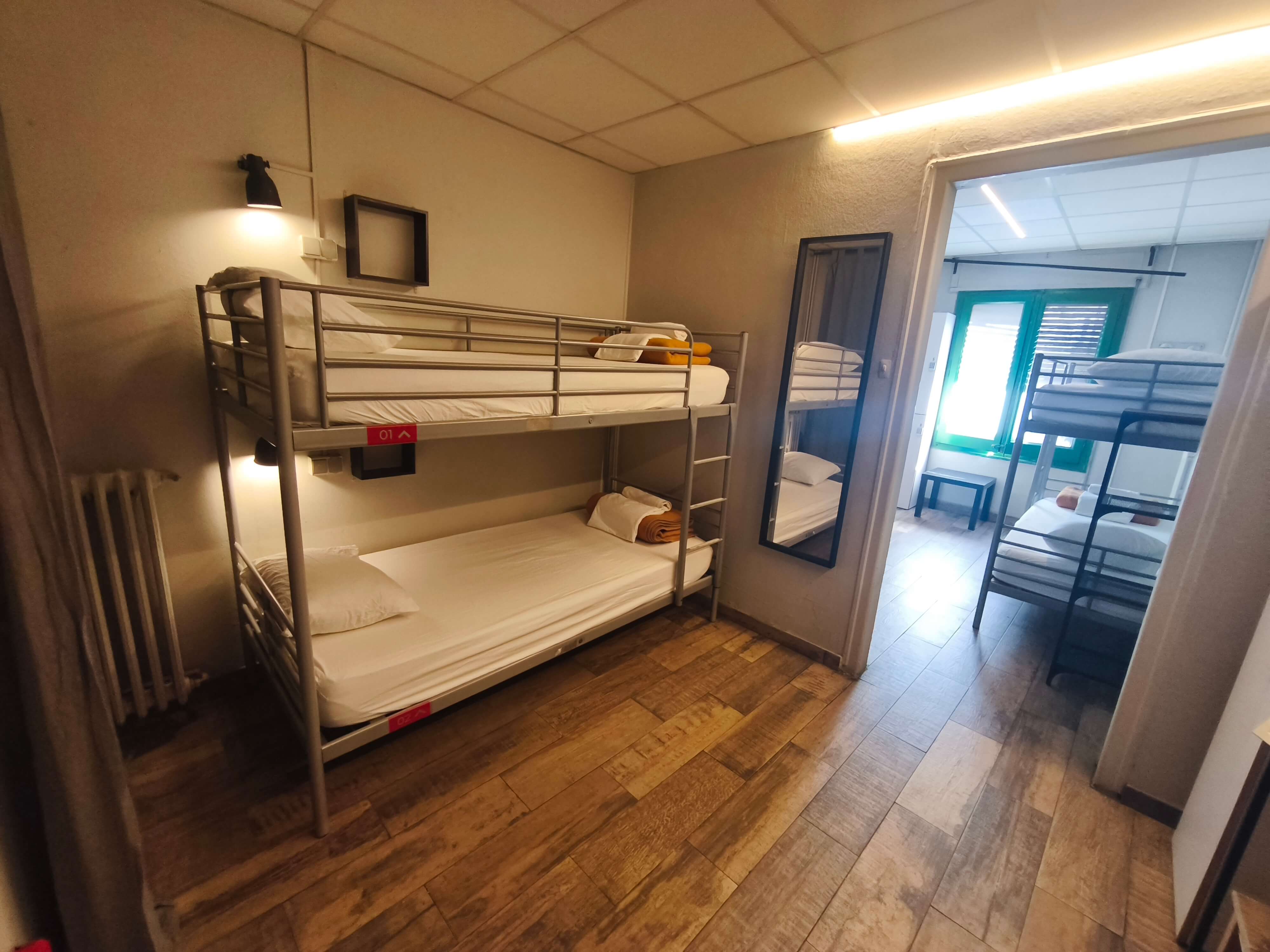Cozy female dormitory room with individual lockers at Buba House